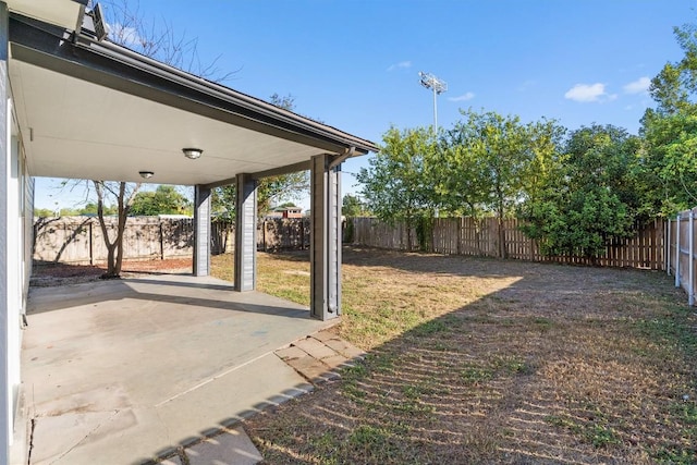 view of yard featuring a patio and a fenced backyard