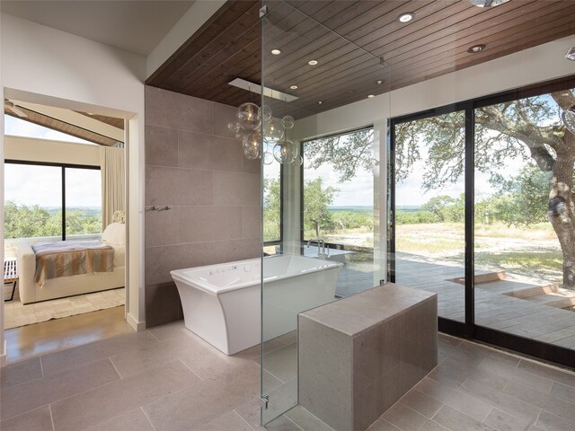 ensuite bathroom with recessed lighting, tile patterned flooring, wood ceiling, ensuite bathroom, and a soaking tub