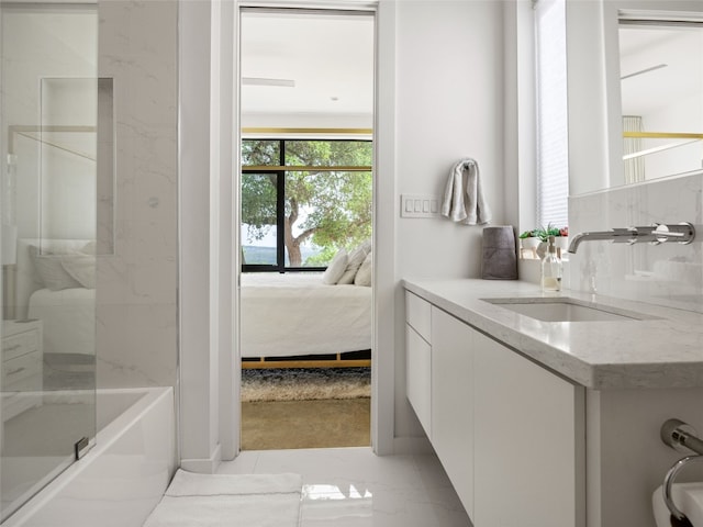 full bathroom with shower / washtub combination, vanity, and tasteful backsplash