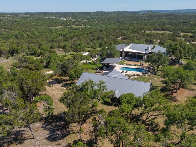 birds eye view of property with a forest view