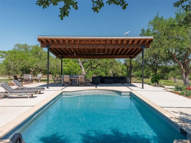pool featuring an outdoor hangout area, outdoor dining area, and a patio area