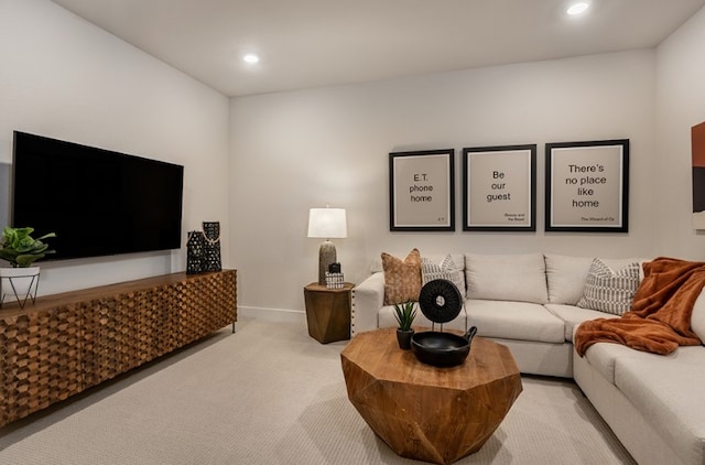 living area with recessed lighting, carpet, and baseboards