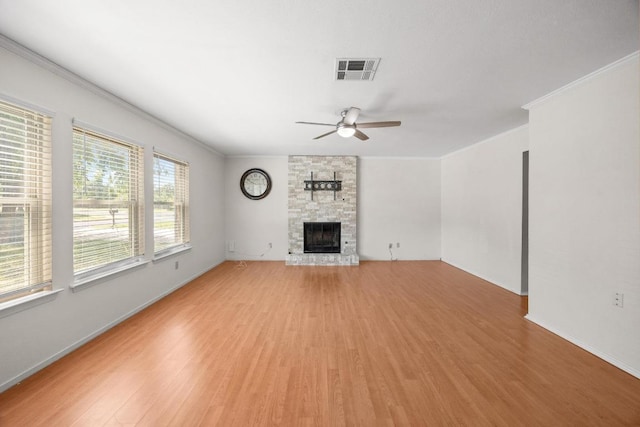 11811 Buggy Whip Trl, Austin, TX 78750 - unfurnished living room with ceiling fan, light wood finished floors, a fireplace, crown molding, and baseboards