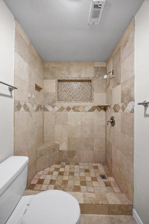 11811 Buggy Whip Trl, Austin, TX 78750 - full bath featuring a tile shower and toilet
