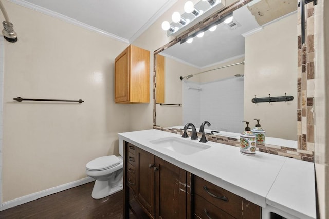 11811 Buggy Whip Trl, Austin, TX 78750 - bathroom featuring ornamental molding, toilet, baseboards, vanity, and wood finished floors