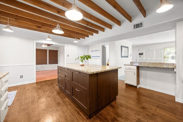 11811 Buggy Whip Trl, Austin, TX 78750 - kitchen featuring beamed ceiling, dark brown cabinets, a ceiling fan, hanging light fixtures, and dark wood-style floors