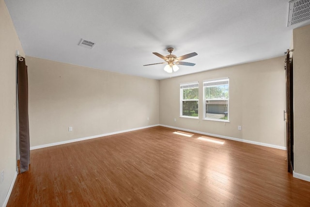 11811 Buggy Whip Trl, Austin, TX 78750 - spare room with a ceiling fan, wood finished floors, and baseboards