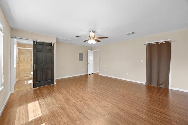 11811 Buggy Whip Trl, Austin, TX 78750 - unfurnished room featuring electric panel, ceiling fan, wood finished floors, and baseboards