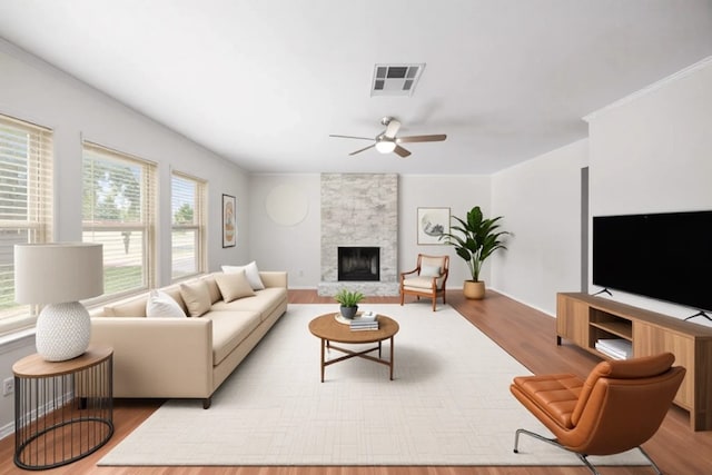 11811 Buggy Whip Trl, Austin, TX 78750 - living area featuring a ceiling fan, wood finished floors, a fireplace, and baseboards