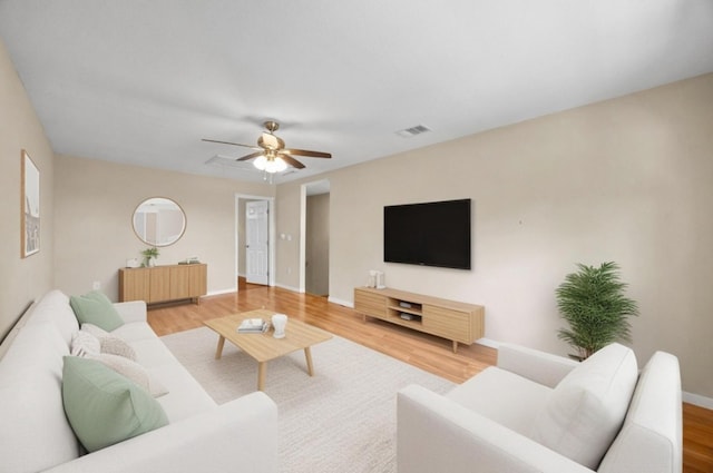 11811 Buggy Whip Trl, Austin, TX 78750 - living room with wood finished floors, baseboards, and ceiling fan