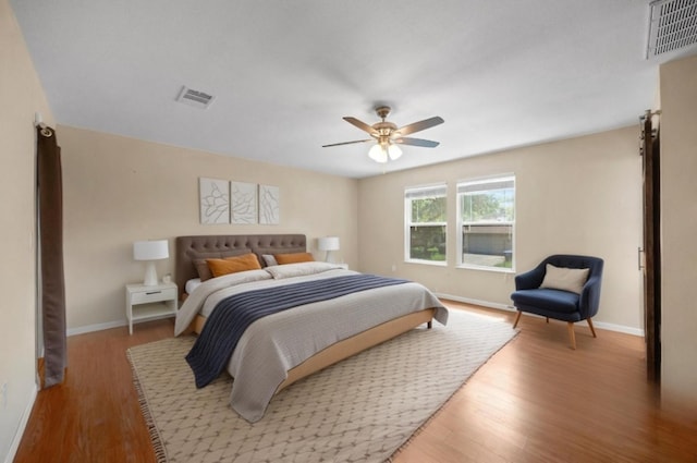 11811 Buggy Whip Trl, Austin, TX 78750 - bedroom with wood finished floors, baseboards, and a ceiling fan