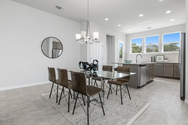 320 Creek Rd Unit 202, Dripping Springs, TX 78620 - dining area featuring a chandelier, recessed lighting, and baseboards