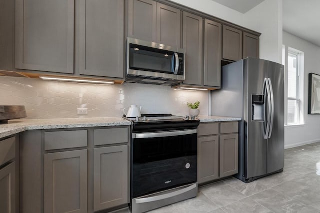 320 Creek Rd Unit 202, Dripping Springs, TX 78620 - kitchen with appliances with stainless steel finishes, plenty of natural light, and gray cabinets