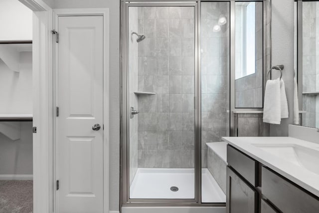 320 Creek Rd Unit 202, Dripping Springs, TX 78620 - bathroom with a shower stall, a closet, and vanity