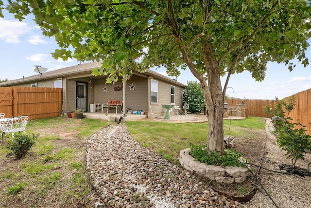 447 Discovery Dr, Kyle, TX 78640 - fenced backyard with a patio