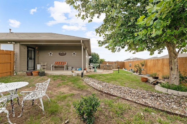 447 Discovery Dr, Kyle, TX 78640 - fenced backyard with a patio