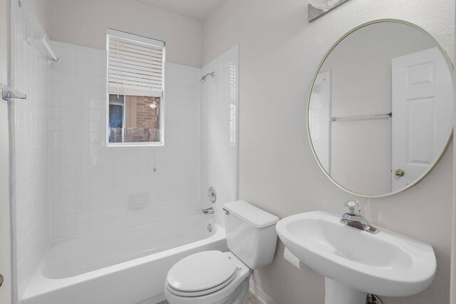 11100 Alison Parke Trl, Austin, TX 78750 - bathroom featuring toilet, a sink, and tub / shower combination