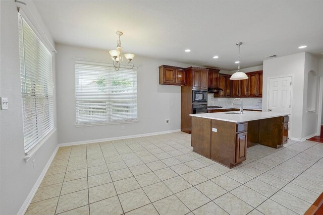 11100 Alison Parke Trl, Austin, TX 78750 - kitchen featuring a sink, black appliances, light countertops, hanging light fixtures, and recessed lighting