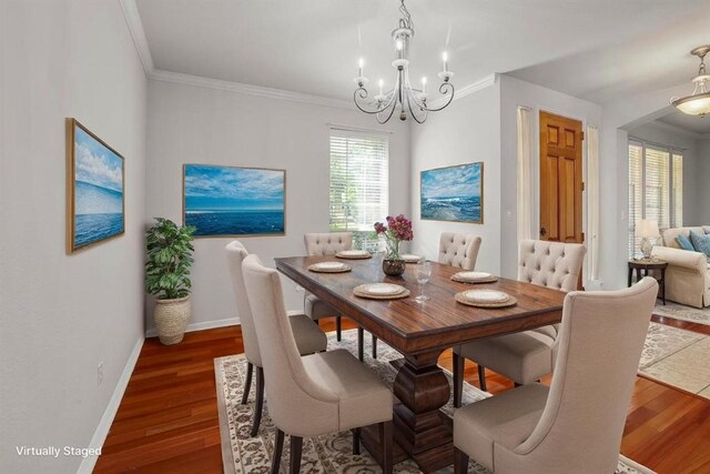 11100 Alison Parke Trl, Austin, TX 78750 - dining area featuring a chandelier, ornamental molding, wood finished floors, and baseboards