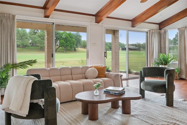 sunroom / solarium with beam ceiling and view of golf course