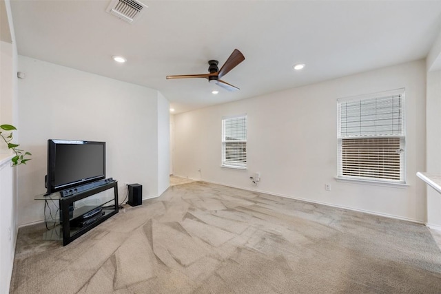 unfurnished living room featuring recessed lighting, ceiling fan, visible vents, carpet, and baseboards