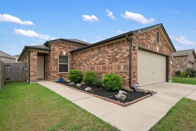 view of front of home with fence, a front lawn, concrete driveway, and brick siding