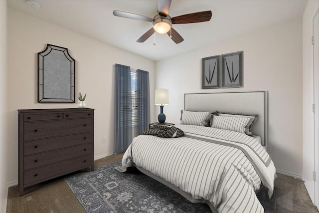 bedroom with dark carpet and ceiling fan
