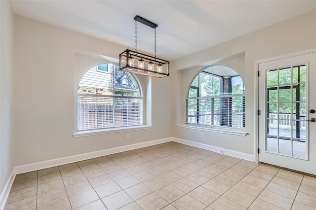 14308 Homestead Village Cir, Austin, TX 78717 - unfurnished dining area with healthy amount of natural light, light tile patterned floors, and baseboards