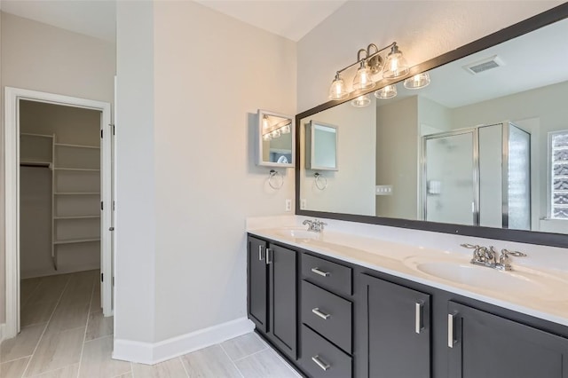 14308 Homestead Village Cir, Austin, TX 78717 - full bath with a stall shower, a spacious closet, double vanity, and baseboards