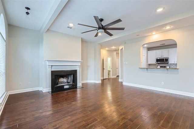 14308 Homestead Village Cir, Austin, TX 78717 - unfurnished living room with a ceiling fan, dark wood finished floors, a fireplace, baseboards, and recessed lighting