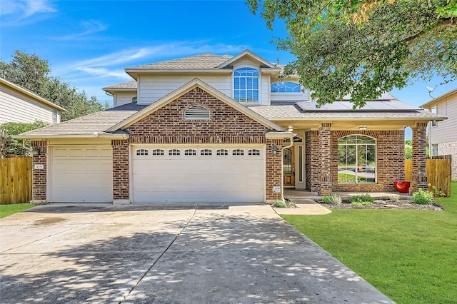 14308 Homestead Village Cir, Austin, TX 78717 - traditional-style home with a garage, concrete driveway, solar panels, and brick siding
