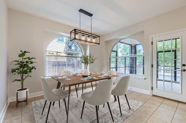 14308 Homestead Village Cir, Austin, TX 78717 - dining room featuring plenty of natural light, light tile patterned floors, and baseboards