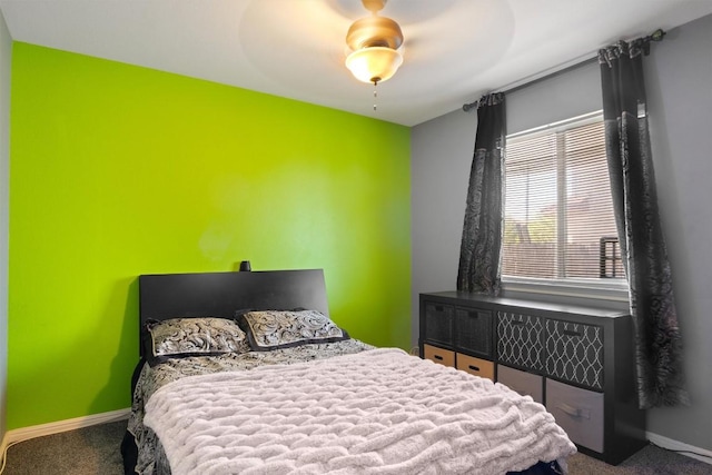 bedroom with carpet, ceiling fan, and baseboards
