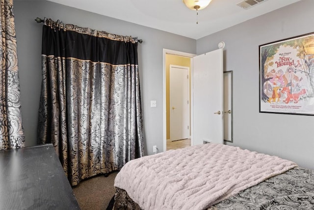 bedroom with visible vents and carpet floors