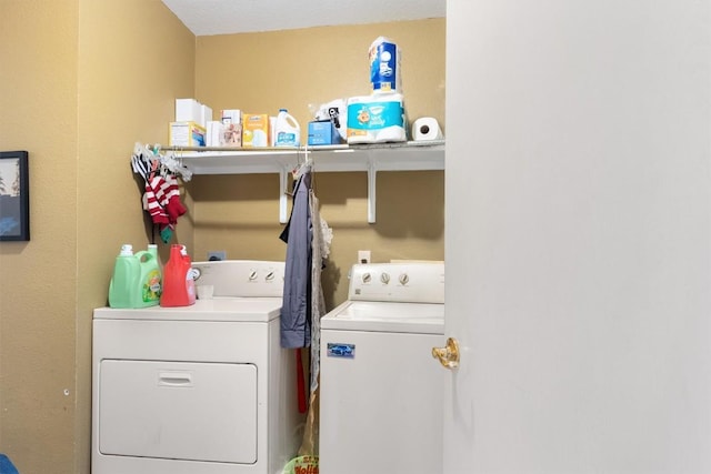 washroom with laundry area and washer and clothes dryer