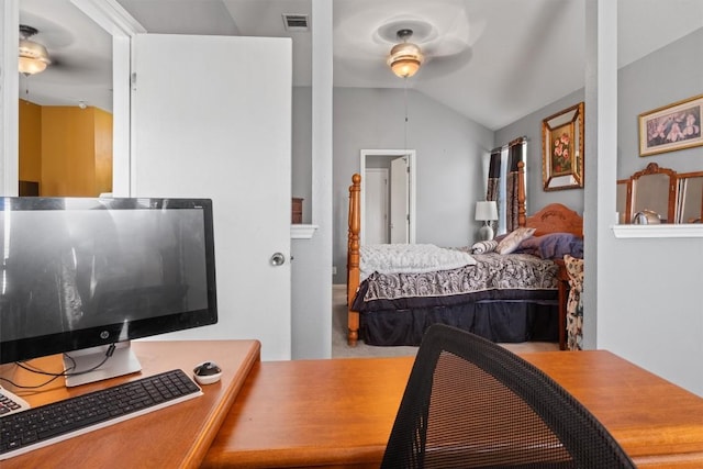 bedroom featuring lofted ceiling and visible vents