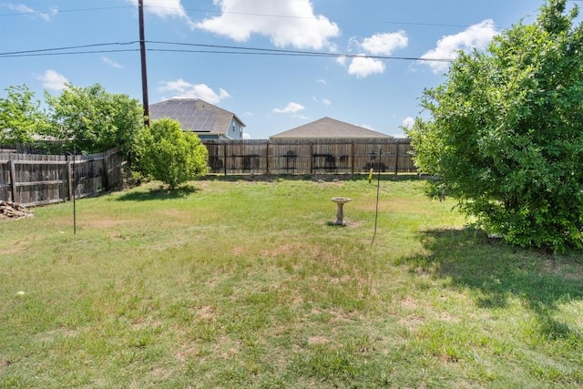 view of yard with a fenced backyard