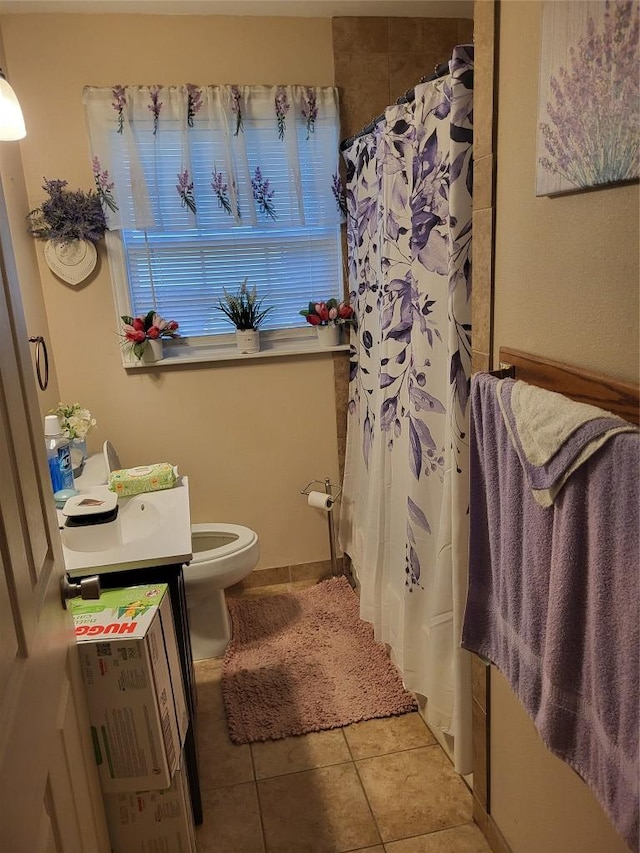 1403 Wallace St, Taylor, TX 76574 - full bathroom featuring tile patterned floors, curtained shower, and toilet