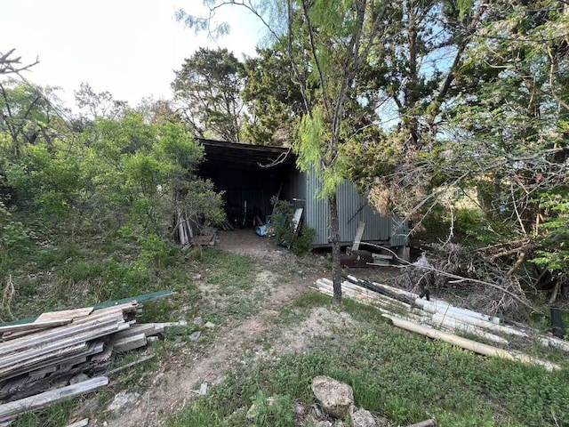 11014 W Lake Terrace Dr, Jonestown, TX 78645 - view of yard with a pole building and an outbuilding