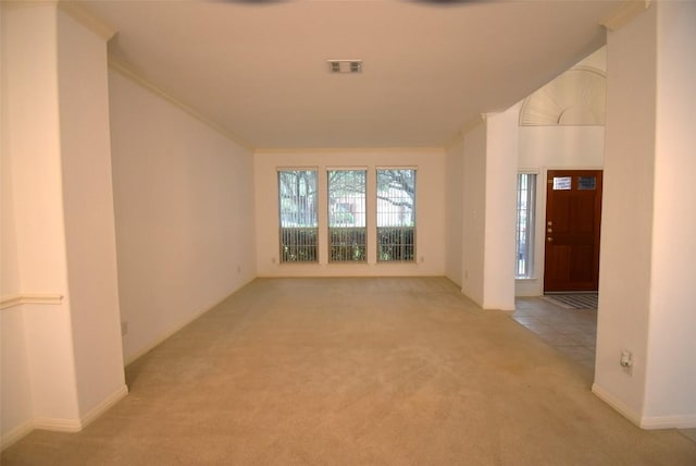 interior space with visible vents and light colored carpet