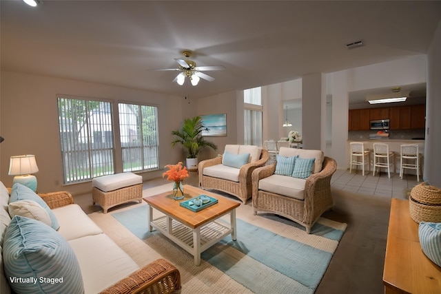 living room with visible vents and ceiling fan