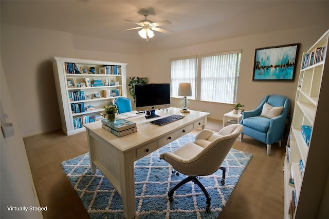 office space featuring baseboards and ceiling fan