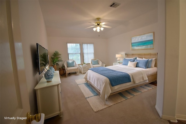 carpeted bedroom featuring visible vents and ceiling fan