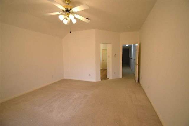 unfurnished bedroom featuring baseboards, a ceiling fan, and light carpet