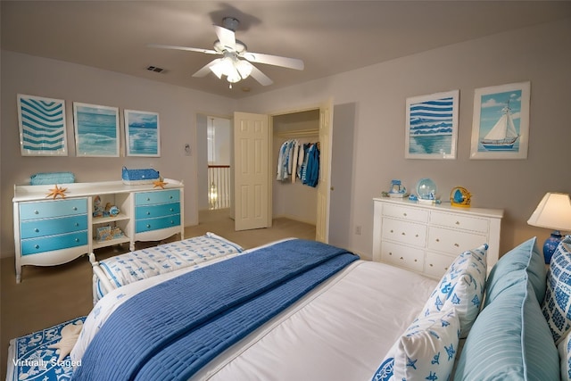 carpeted bedroom featuring visible vents and ceiling fan