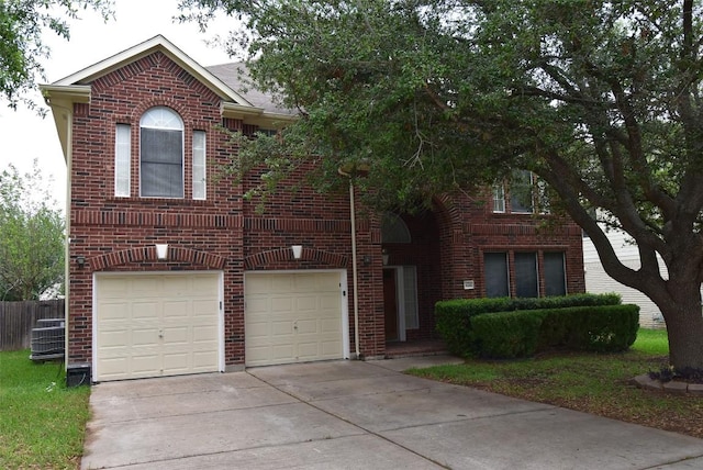 view of front facade featuring concrete driveway, fence, a garage, and brick siding