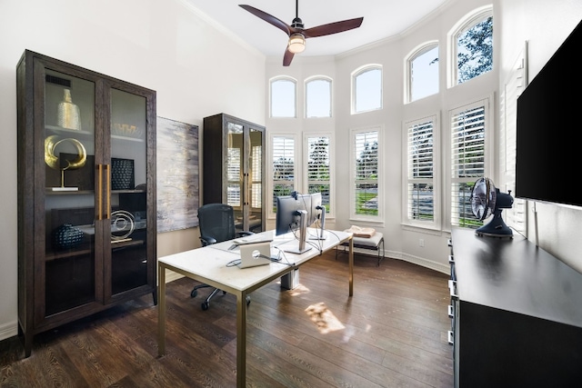 office area featuring crown molding, baseboards, and dark wood finished floors