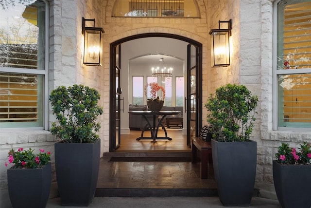 property entrance featuring stone siding