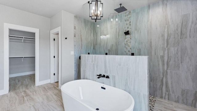 725 Winding Vw, New Braunfels, TX 78132 - bathroom with a freestanding tub, a walk in shower, a spacious closet, and a notable chandelier