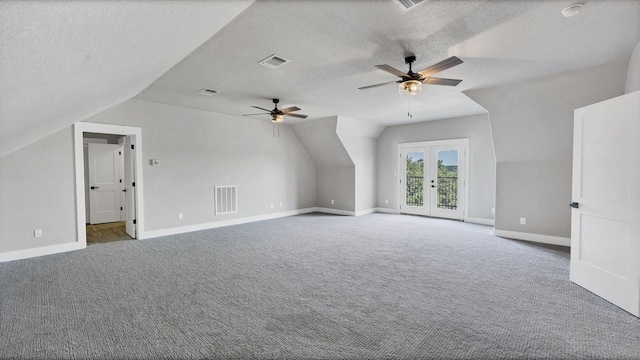 725 Winding Vw, New Braunfels, TX 78132 - additional living space with carpet flooring, visible vents, a ceiling fan, french doors, and lofted ceiling